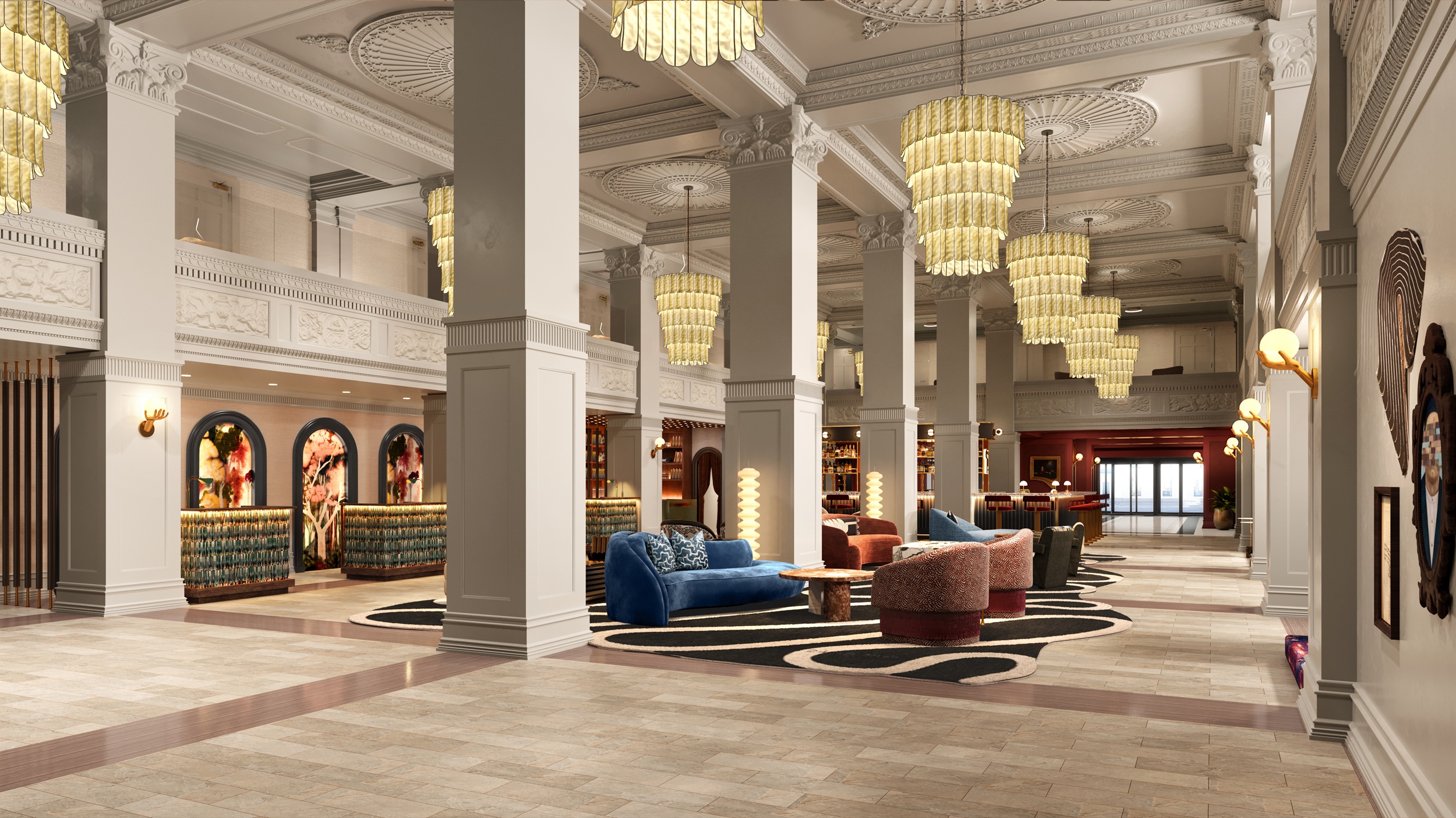 a large lobby with a large chandelier and couches